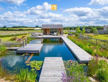 Gold Winner Design Award 2023 Idyllic natural pond surrounded by pure nature