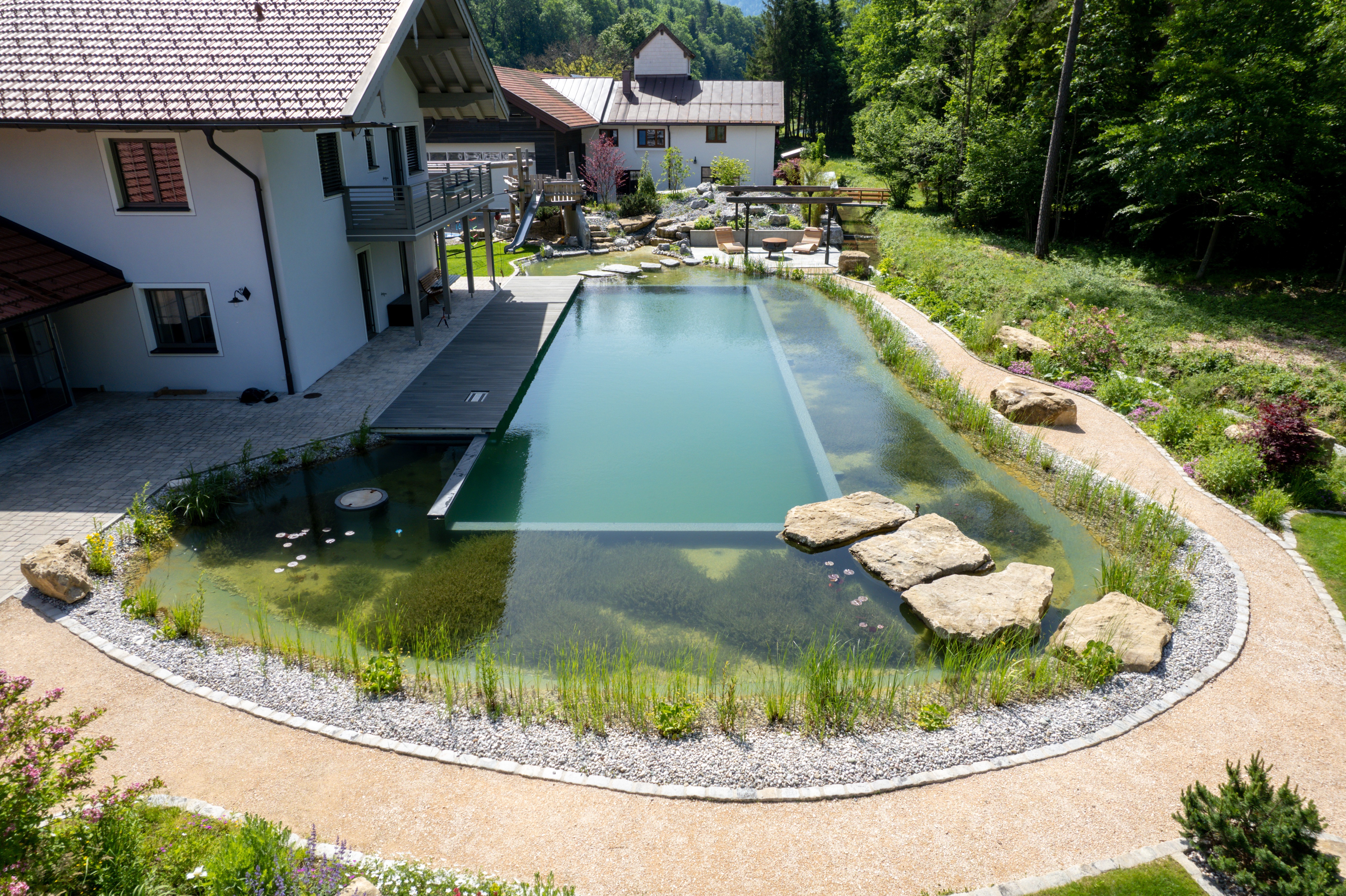 swimming-pond-with-stepping-stones-and-waterfall-Ruhpolding-DE-2